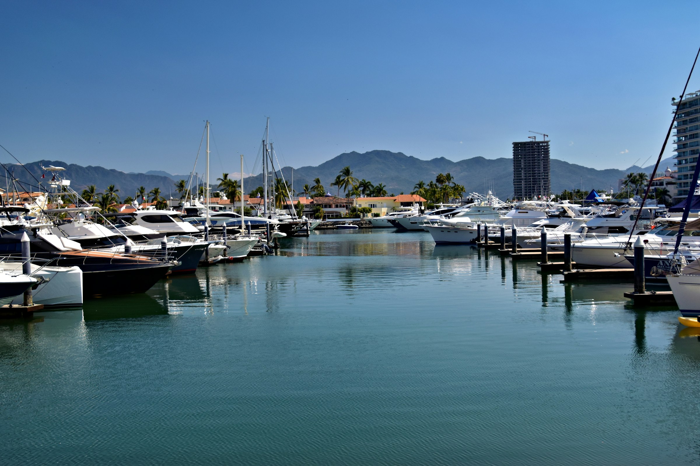 Yachts and motor boats moored in a marina